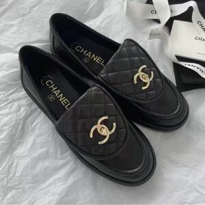 CHANEL Quilted Black Loafers with Gold Logo